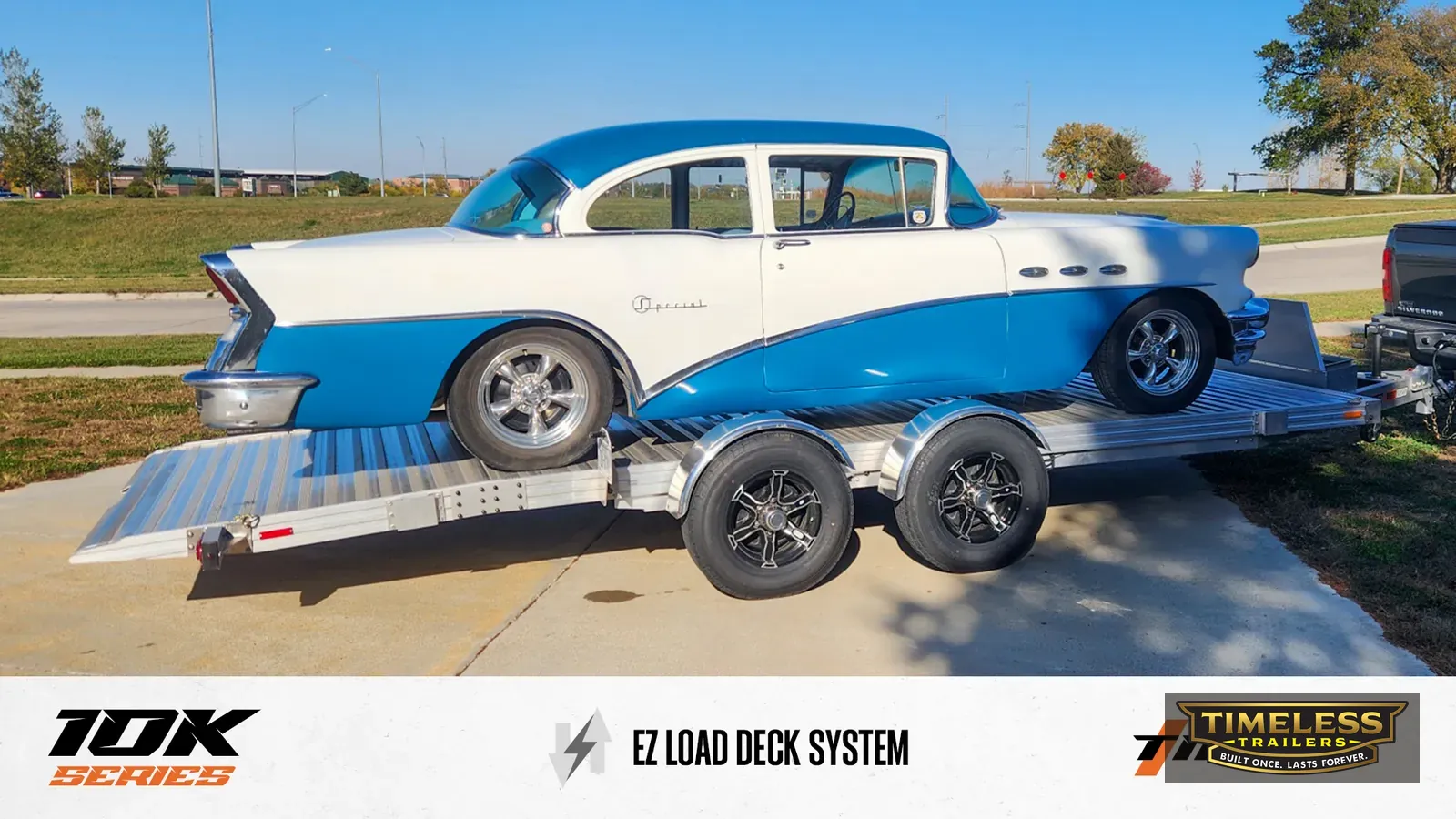 Timpte 1020 EZ Load carrying a two-tone 1950s classic car