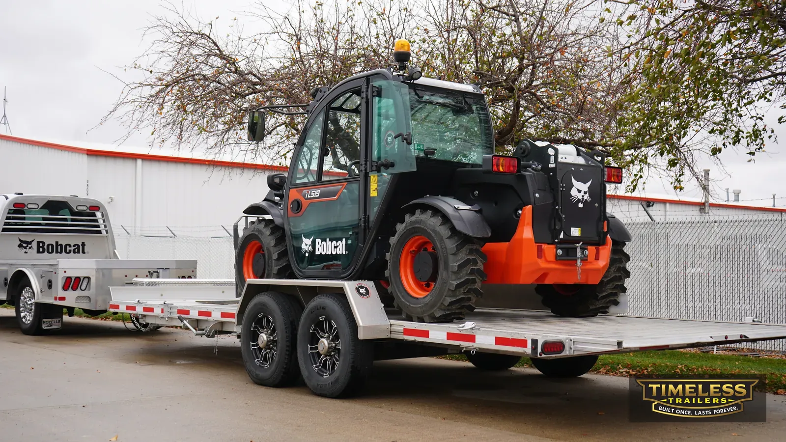 Timpte 1624 Split Tilt carrying a Bobcat telehandler